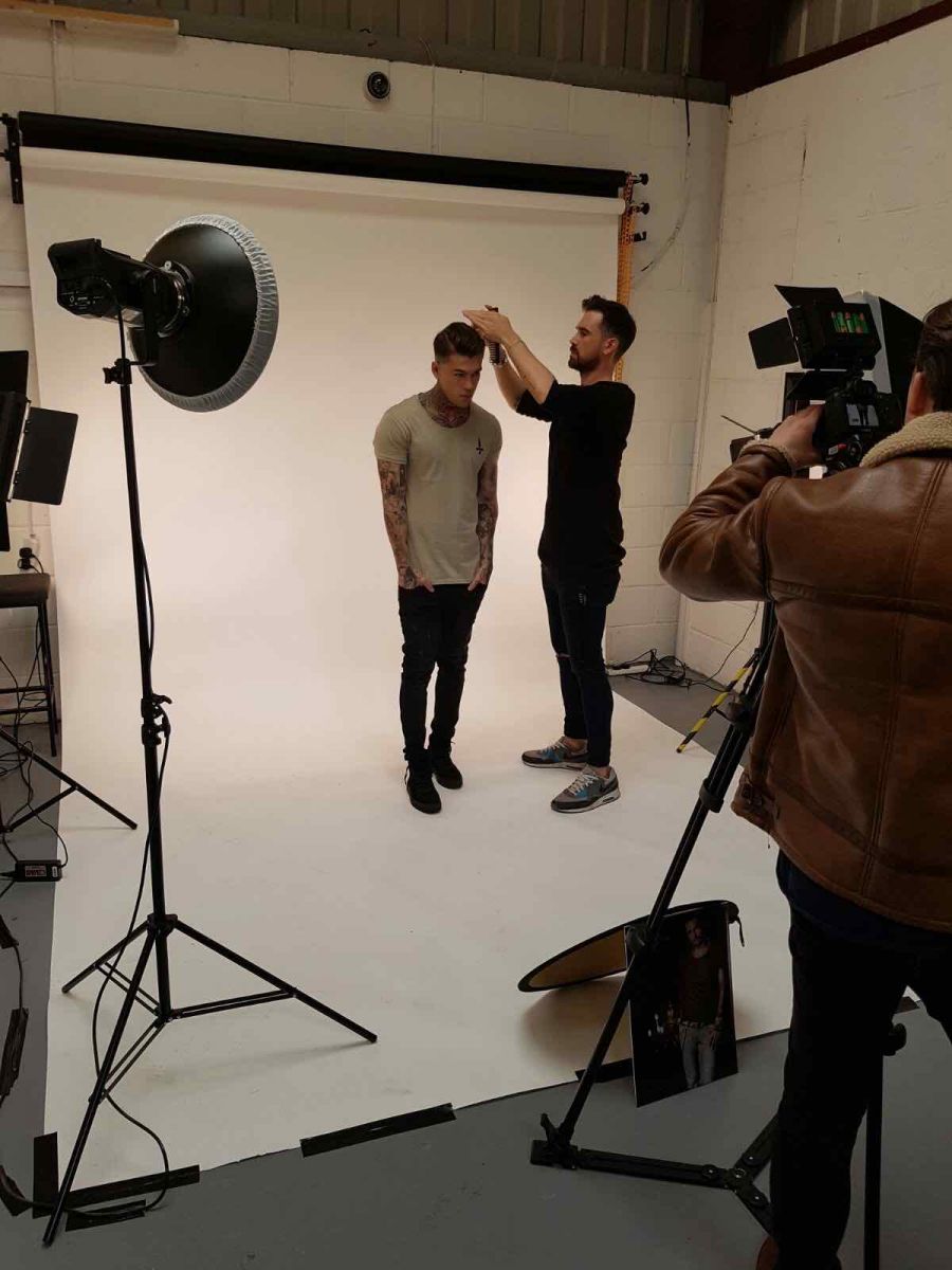 Model Stephen James getting a helping hand to look great during a photoshoot