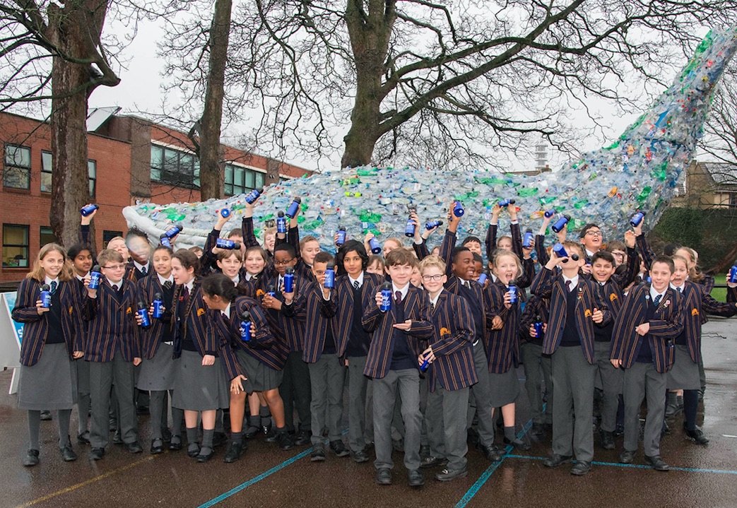 Pupils at Colston's School in Bristol with giant whale made out of recycled plastic
